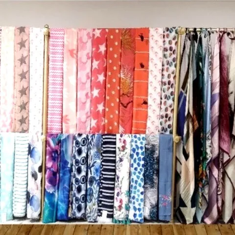 Scarf samples on the showroom rack